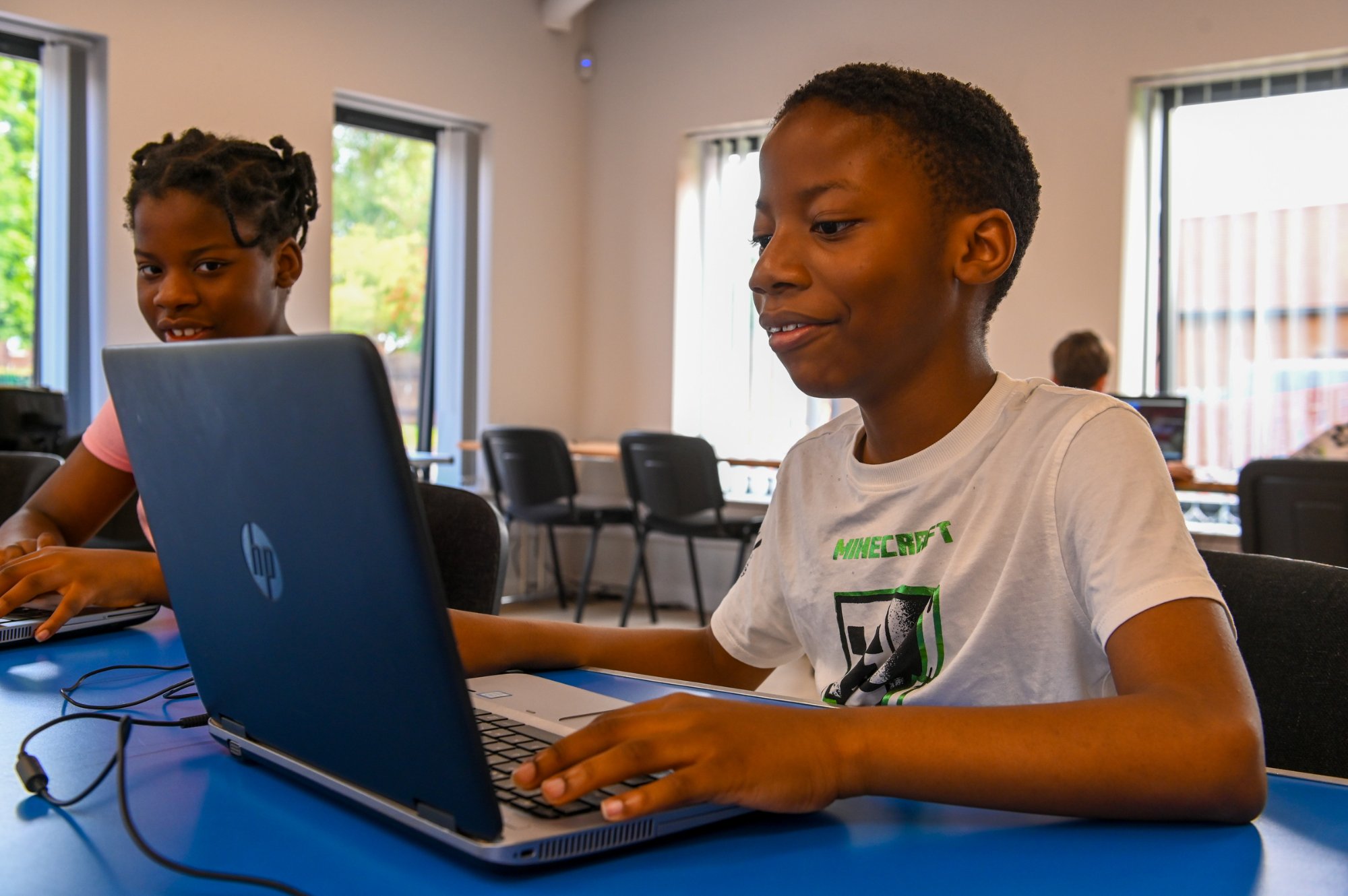 children using laptop at minecraft class
