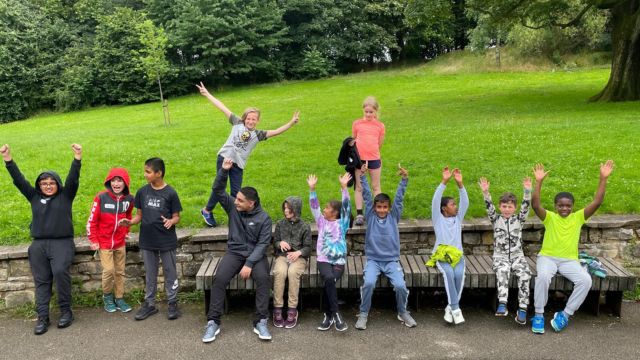 group of children at park for fresh air break on holiday camp